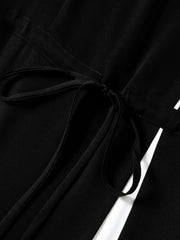 Close-up of Minimalist Black Silk Dress