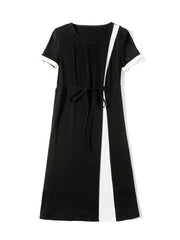 Profile of Minimalist Black Silk Dress