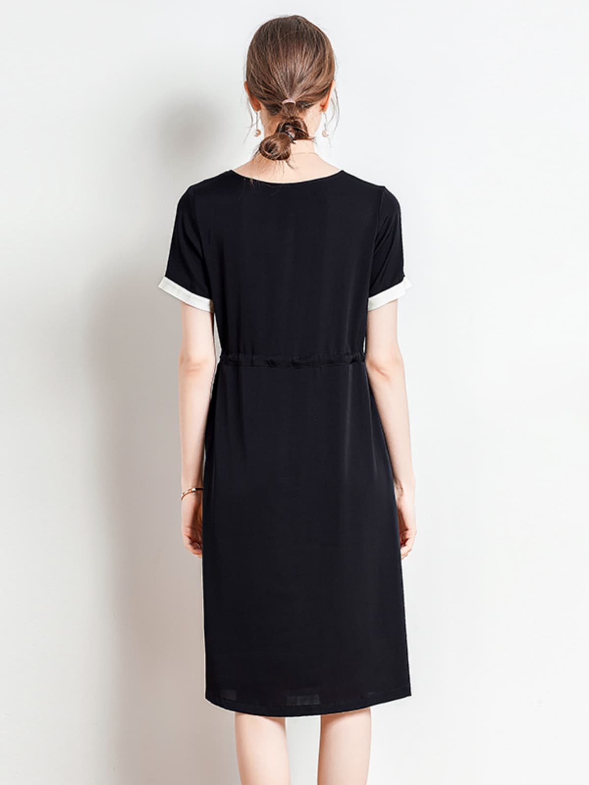 Back view of Minimalist Black Silk Dress