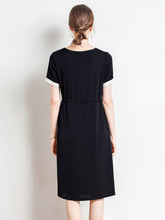 Back view of Minimalist Black Silk Dress