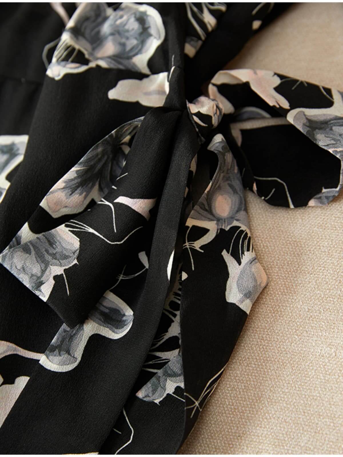 Detail of Chic Floral One - Piece Mulberry Silk Dress showcasing floral pattern and elegant tie.