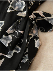 Detail of Chic Floral One - Piece Mulberry Silk Dress showcasing floral pattern and elegant tie.