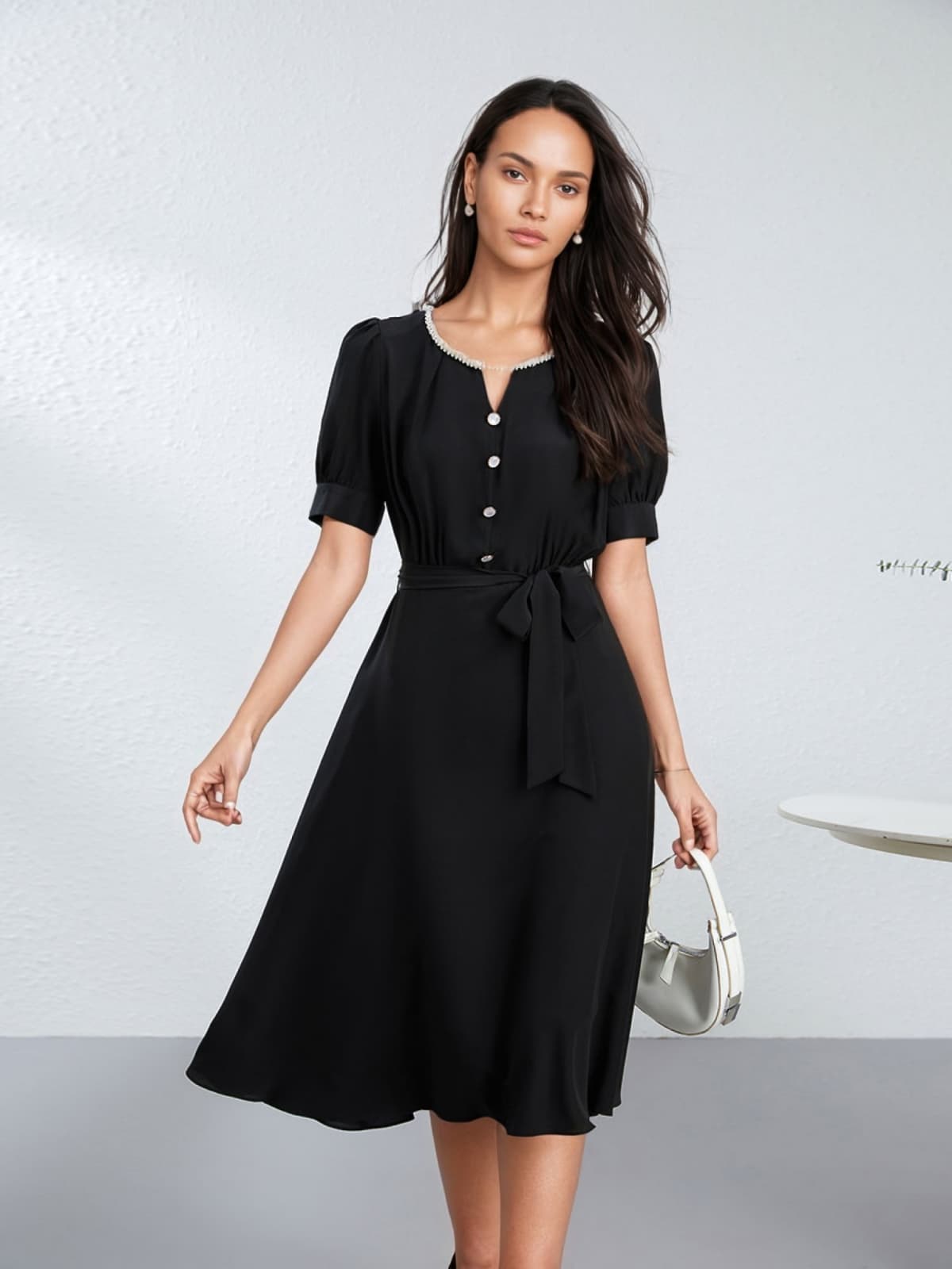 Our model is wearing 2025 Black Beaded Mulberry Silk Dress in the office