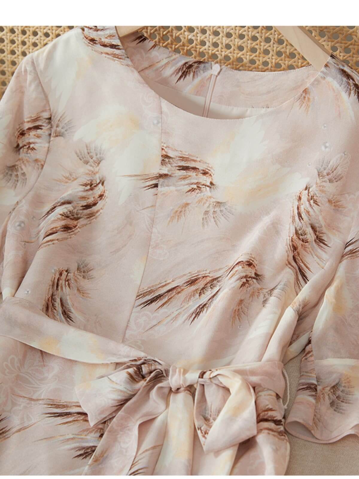 Close-up of a Summer Petite Mulberry Silk Dress featuring a floral design and elegant tie waist detail.
