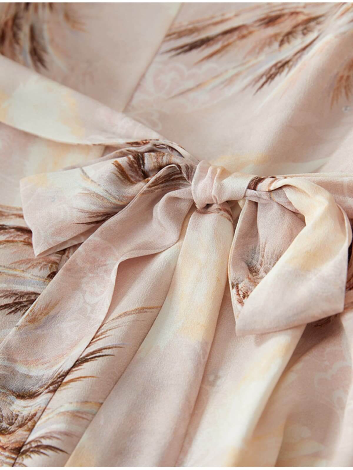 Close-up of the bow detail on the Summer Petite Mulberry Silk Dress showcasing its elegant fabric design.