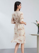 Woman wearing a Summer Petite Mulberry Silk Dress with a flowy design, seen from the back against a neutral background.