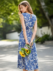 Graceful Mulberry Silk Maxi Dress worn by a woman holding sunflowers in a scenic outdoor setting.