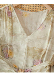 Elegant Mulberry Silk Dress with ruched waist featuring floral design and delicate V-neckline.