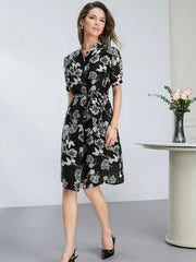Modeling wearing 100% Mulberry Silk A-Line Dress - Black Midi Slim Fit in office