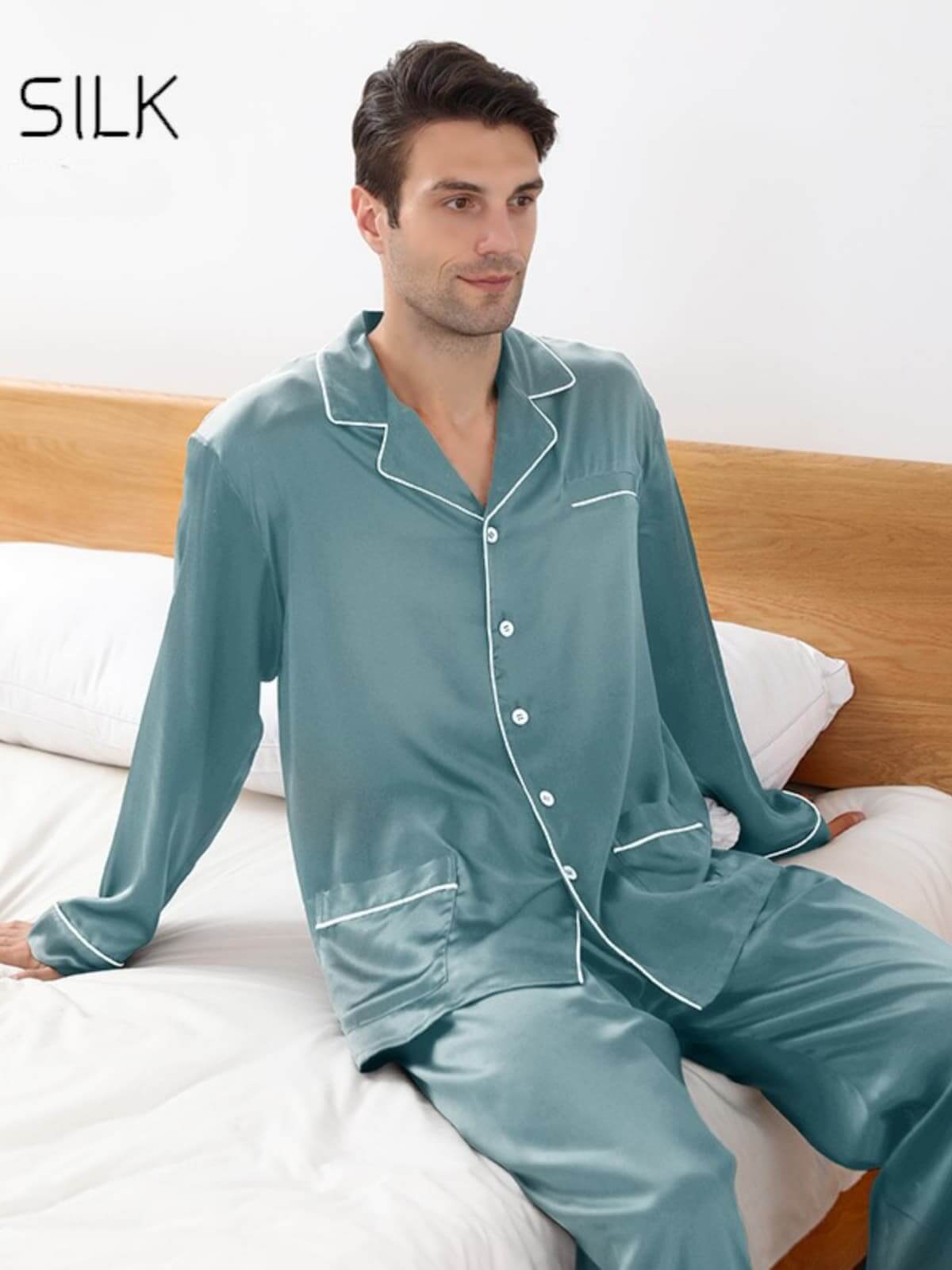Model wearing Long Sleeve Men's Silk Pajama Set 22mm Luxury sitting on the bed