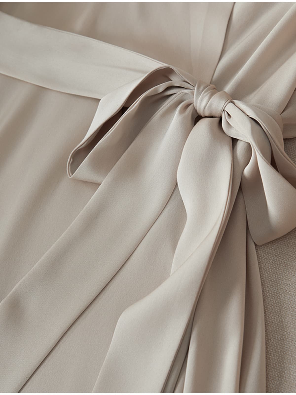 Close-up of the elegant tie detail on the Heavyweight Ruched Waist Mulberry Silk Maxi Dress.