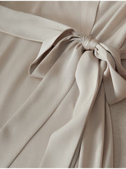 Close-up of the elegant tie detail on the Heavyweight Ruched Waist Mulberry Silk Maxi Dress.
