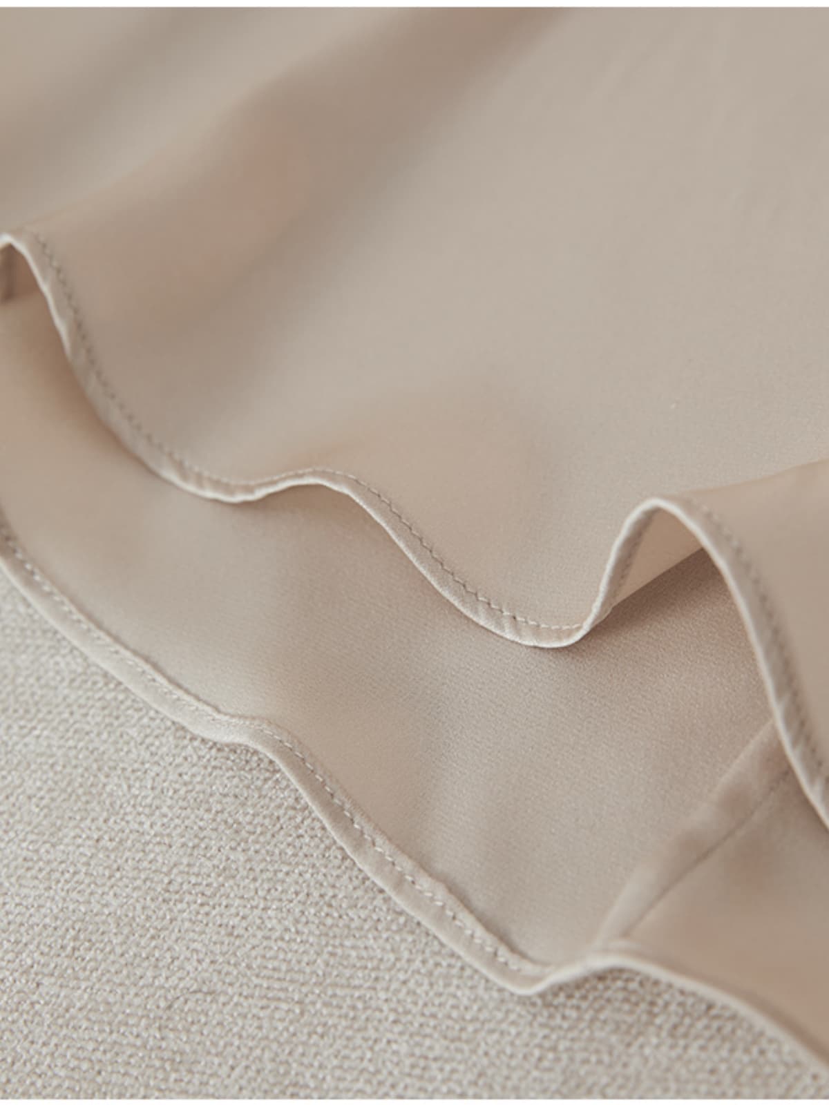 Close-up of the fabric texture of the Heavyweight Ruched Waist Mulberry Silk Maxi Dress, showcasing the soft, lightweight feel.