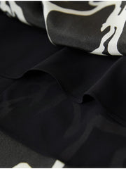 Close-up of floral Mulberry silk fabric layers showcasing texture and design for a Floral Mulberry Silk Dress.