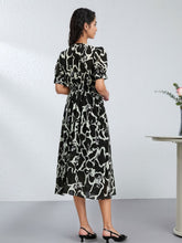 Elegant Floral Mulberry Silk Dress for Women featuring a black and white artistic pattern, perfect for stylish comfort.