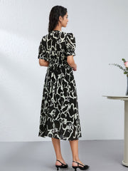 Elegant Floral Mulberry Silk Dress for Women featuring a black and white artistic pattern, perfect for stylish comfort.