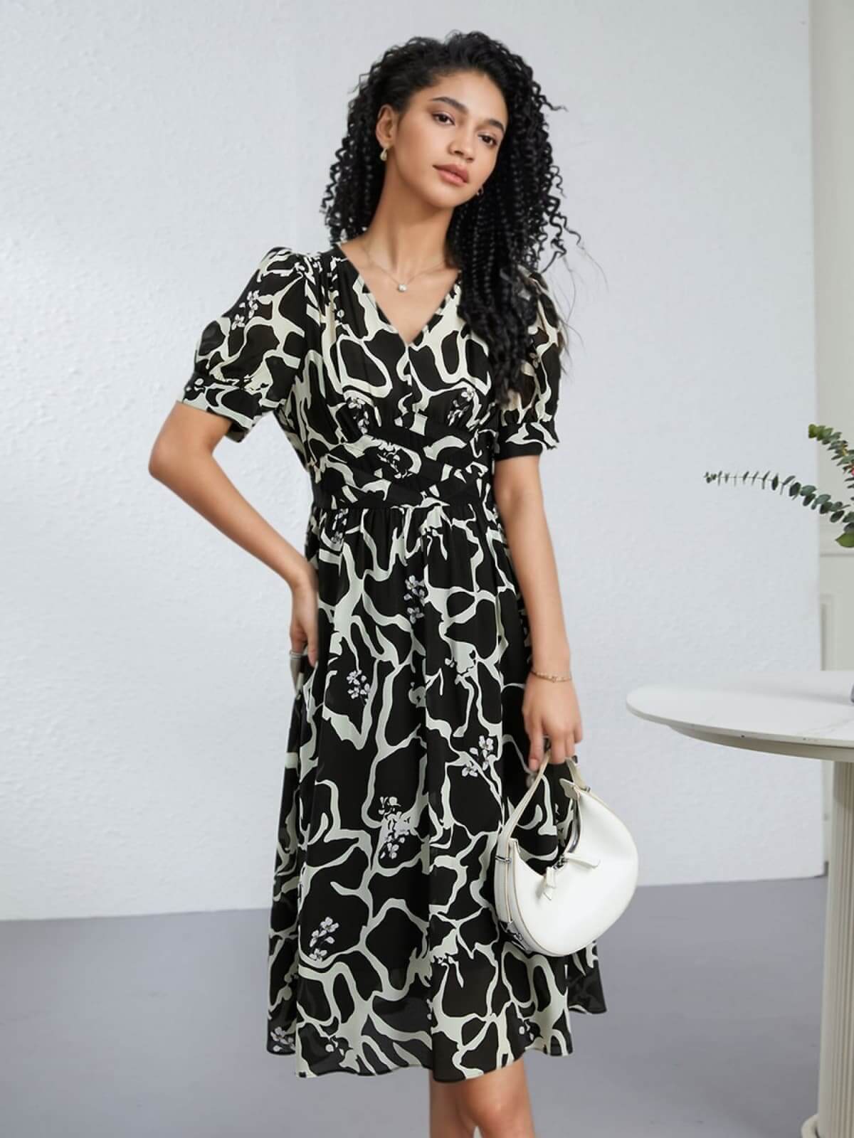 Floral Mulberry Silk Dress for Women, featuring a stylish black and white floral pattern and elegant sleeve design.
