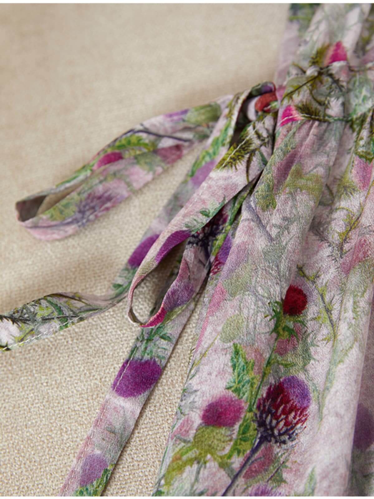 Luxury Mulberry Silk Maxi Dress close-up of floral tie detail on soft fabric