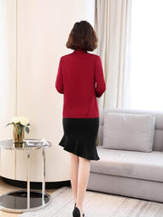 Back view of a woman wearing a Women's Refined Minimalist Silk Blouse paired with a stylish black skirt.