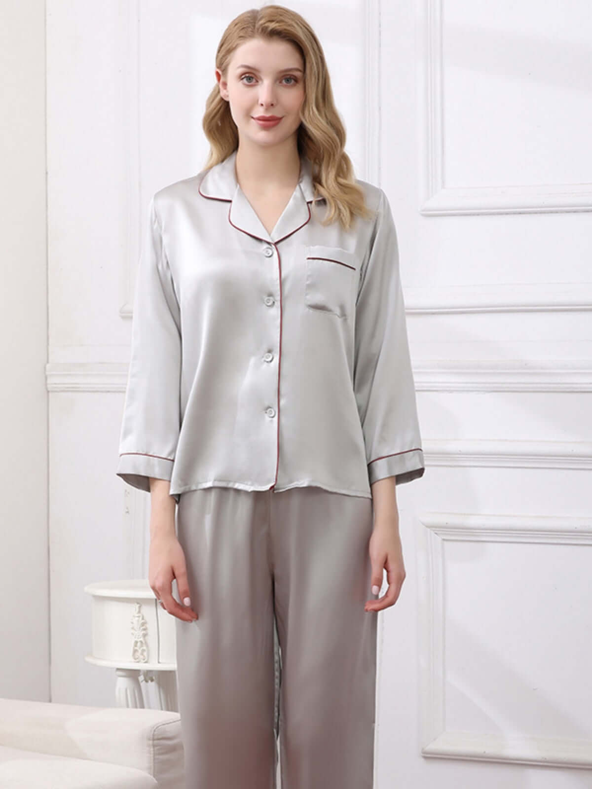 Model weareing women's cozy long - sleeved pure silk pajamas set at home