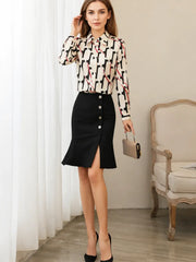 a woman wearing a Luxury Printed Mulberry Silk Blouse paired with black pants in a stylish setting SILKSER