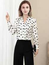 Polka Dot V-neck Mulberry Silk Blouse worn with black pants, showcasing a stylish back view.-SILKSER