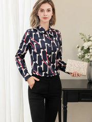 a woman wearing a Luxury Printed Mulberry Silk Blouse paired with black pants in a stylish setting SILKSER