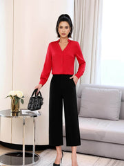 Trendy Silk Women's Blouse styled for casual and office wear, featuring a red silk top paired with black pants.