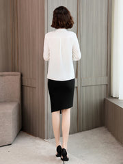 Trendy Silk Women's Blouse back view worn with a black skirt, perfect for casual and office settings.