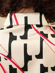 Luxury Printed Mulberry Silk Blouse for Women showcasing a stylish collar and unique pattern.