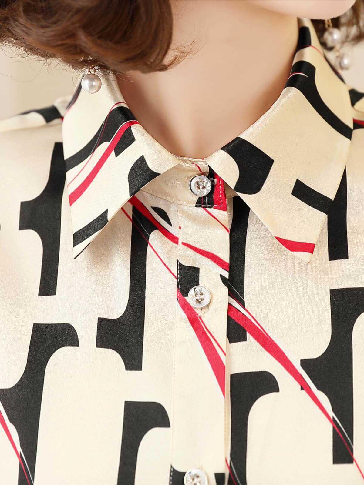Luxury Printed Mulberry Silk Blouse for Women featuring a stylish collar and unique printed pattern.