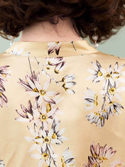 Back view of Floral Mulberry Silk Blouse for Women featuring a floral pattern on a soft silk fabric.