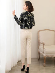 Floral Long Sleeve Mulberry Silk Blouse for Women shown in a stylish outfit with beige pants and heels.