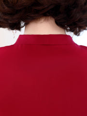 Back view of a woman wearing a Ribbon Tie Mulberry Silk Blouse showcasing the elegant collar design.