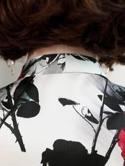 Back view of Bow Tie Printed Mulberry Silk Blouse for Women featuring a floral design.