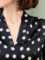 Polka Dot V-neck Mulberry Silk Blouse featuring a stylish polka dot pattern and elegant neckline detail.