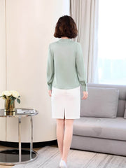 Chic V-neck Silk Blouse back view, styled with a white skirt for work or casual weekend outings.