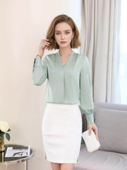 Chic V-neck Silk Blouse model wearing a green blouse and white skirt, perfect for work and weekend outfits.