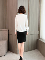 Back view of Chic V-neck Silk Blouse paired with a black skirt, ideal for work and weekend outfits.