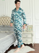 Model wearing stylish short - sleeved men's silk pajamas at home