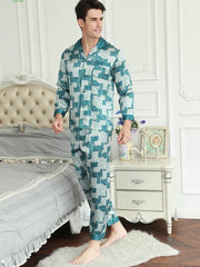 Model wearing stylish short - sleeved men's silk pajamas at home
