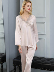 Model wearing Embroidered Long - Sleeved Silk PJs for Women at home