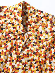 Close-up of Heart Printed Pure Silk Blouse in yellow and red color