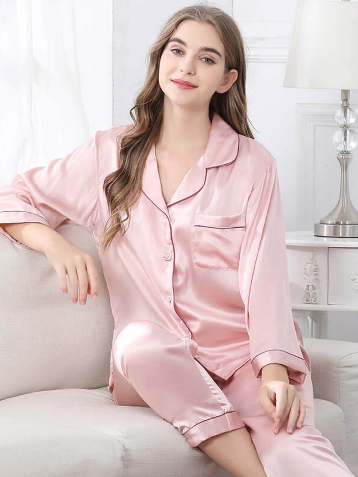 Model sitting on the sofa with a Long - Sleeved Pure Silk Pajama Set for Women