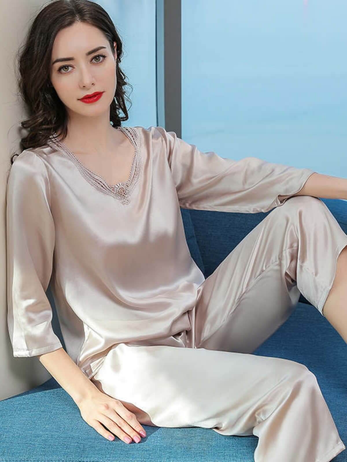 Model wearing Women's Minimalist Silk Pajama Set – Soft Loungewear on the sofa