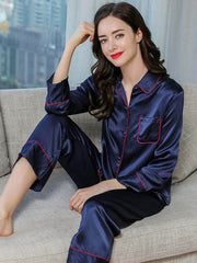 Model wearing Women's Long Sleeve Silk Pajama Set – Soft Sleepwear on the sofa