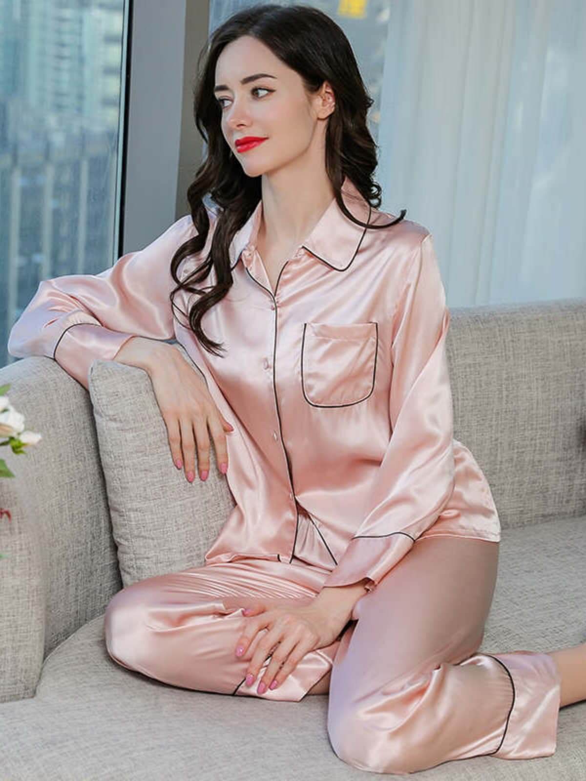 Model wearing Women's Long Sleeve Silk Pajama Set – Soft Sleepwear in pink at home
