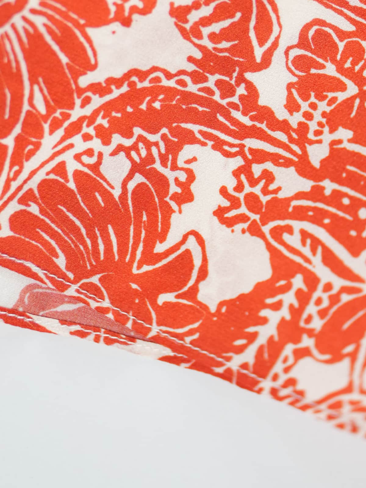 Graceful Mulberry Silk Maxi Dress featuring a vibrant red floral pattern on a white background.