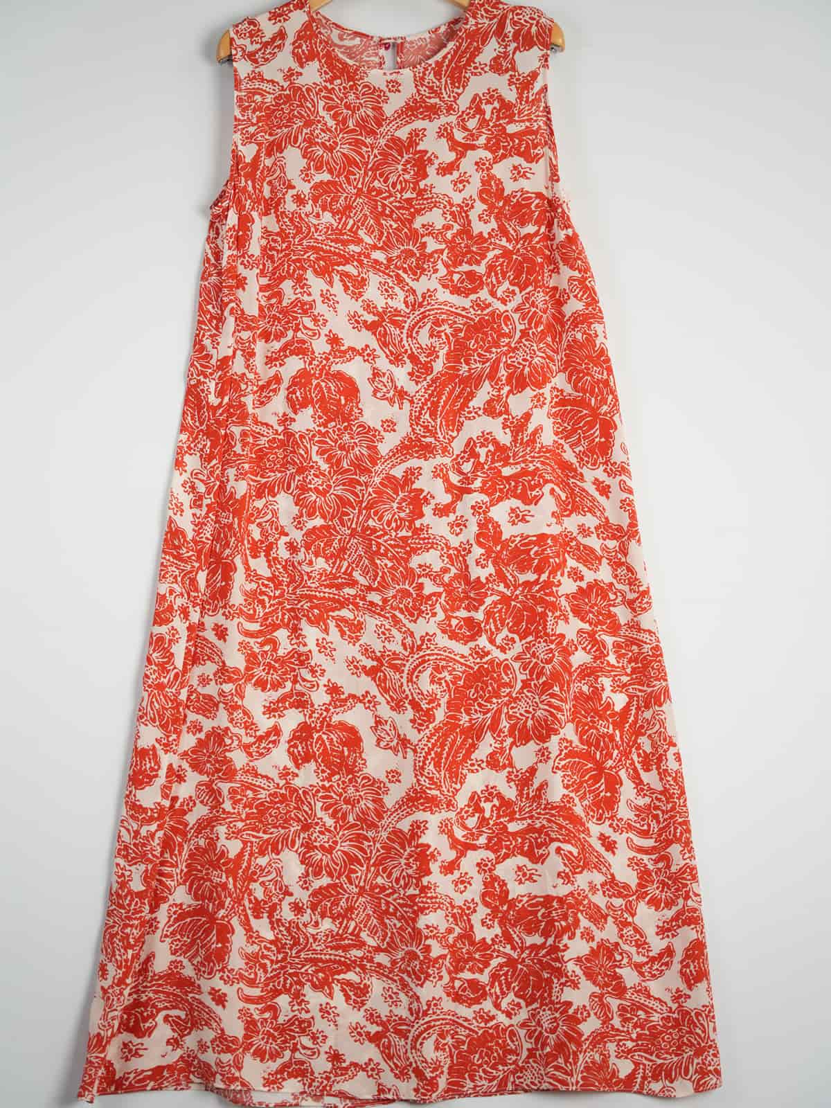 Graceful Mulberry Silk Maxi Dress featuring a vibrant red floral pattern on a white background.