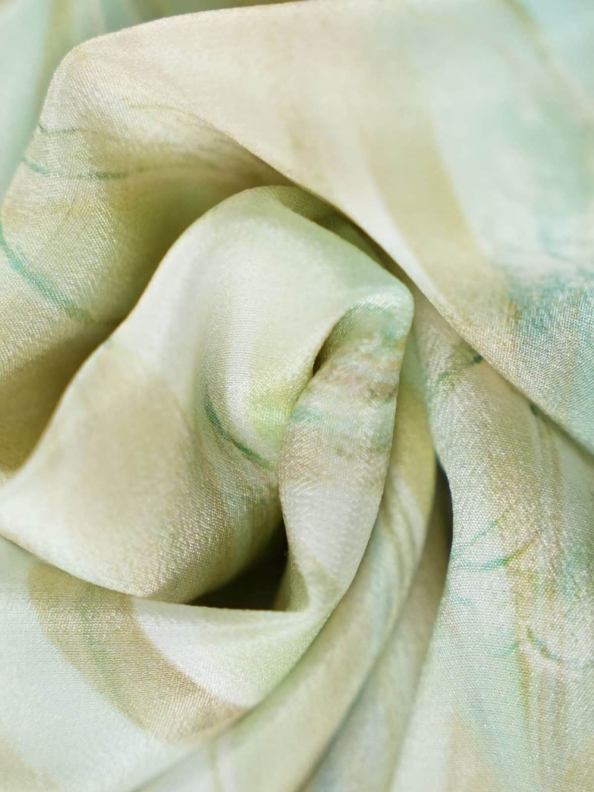 Resort Style Mulberry Silk Dress fabric close-up showcasing soft, breathable texture in gentle pastel colors.